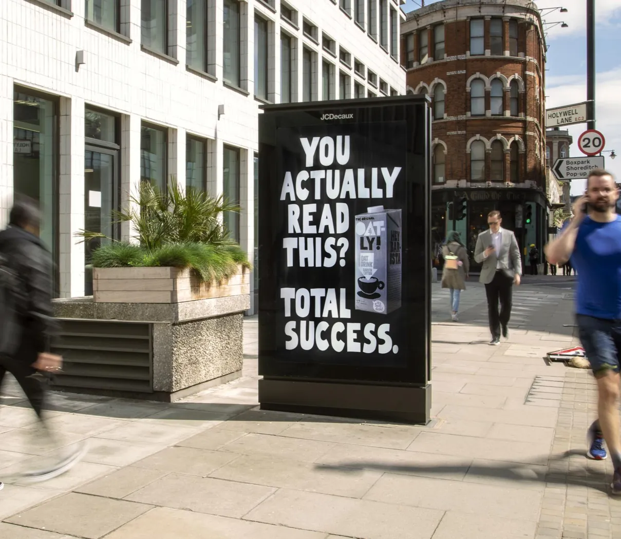 Digital 6-sheet street furniture panel on a pedestrian street