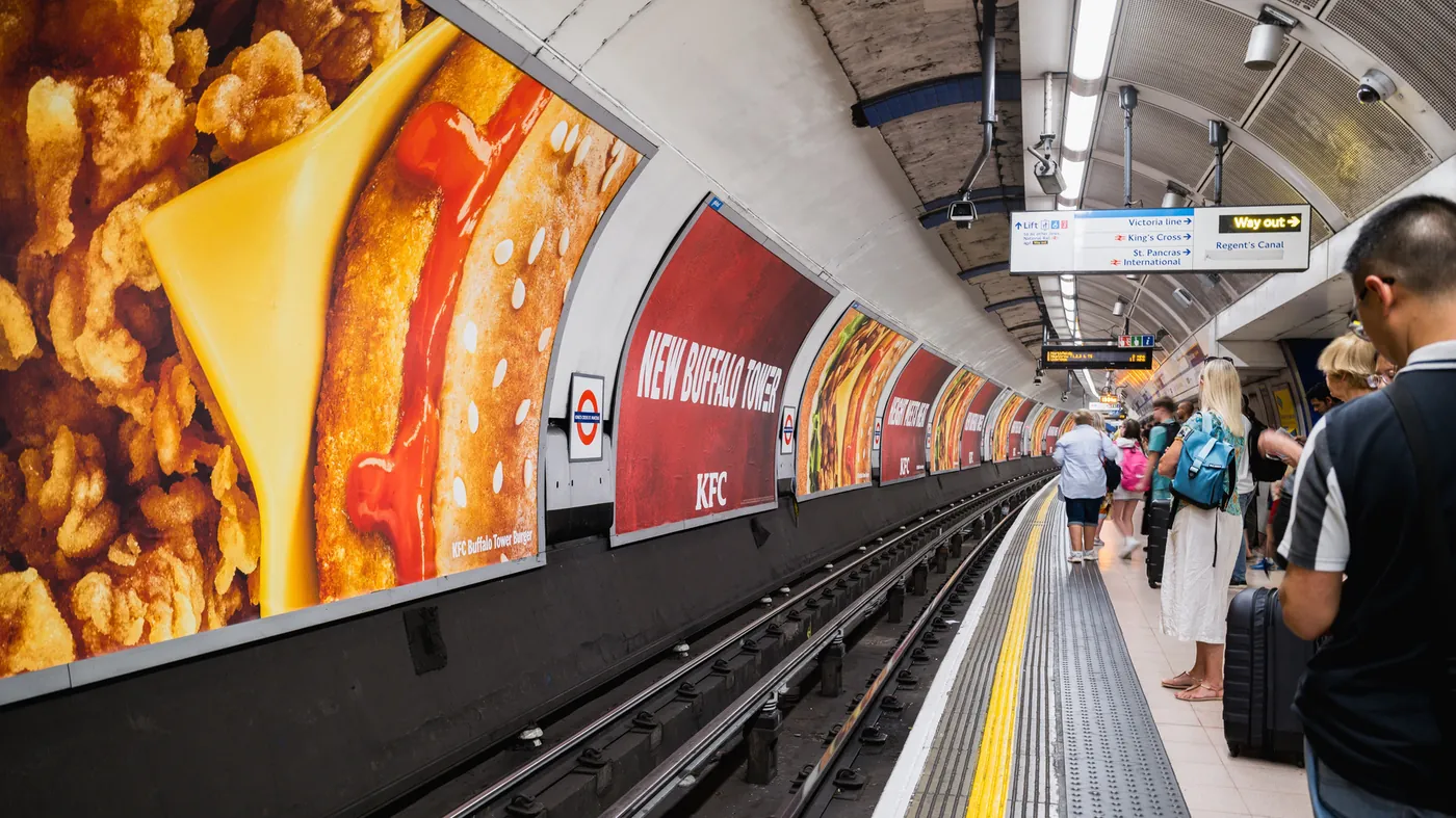 Platform 48-sheet posters along an Underground platform