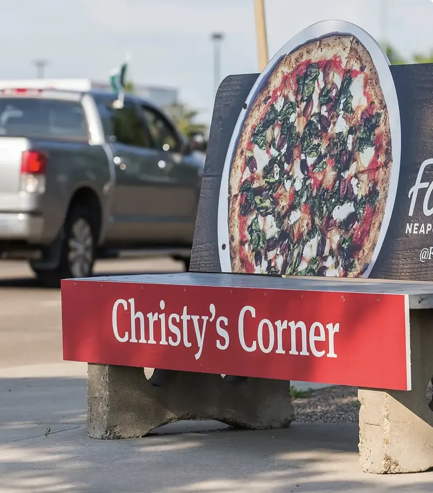 Pattison bench advertising at a roadside