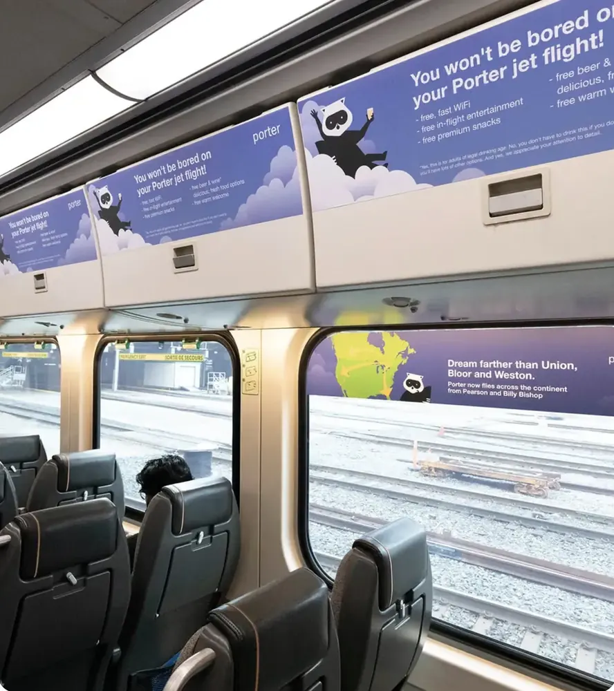 Interior advertising cards inside a commuter rail car