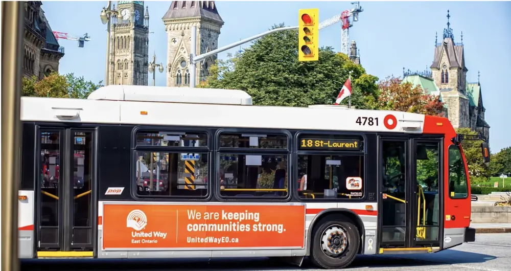 Bus superside on an OC Transpo bus beside Parliament Hill, Ottawa