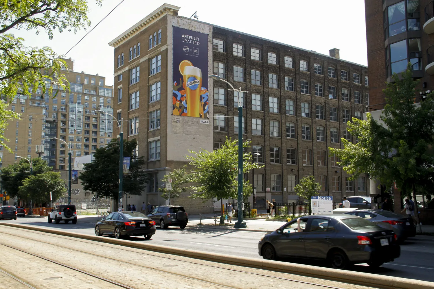 Wallscape seen at street scale beside a Toronto streetcar route